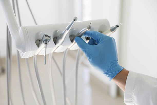 Professional Tooth Extraction technician working in Loves Park, IL